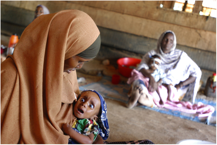 An undernourished girl with her mother at the hospital in IFO refugee camp.