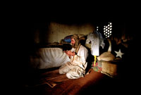 A worker prays in his quarters
