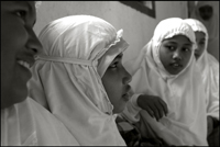 Girls prepare themselves for the midday prayer at an orphanage in Banda Aceh Indonesia