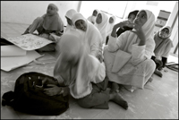 A young girl falls asleep during the English lesson at an orphanage in Banda Aceh Indonesia