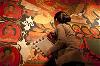 A local Loba woman do the wall paintings inside the Gompa in Lo Manthang.