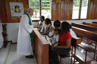 Baptise Ceremony in one village's Roman Catholic Church : Suriname